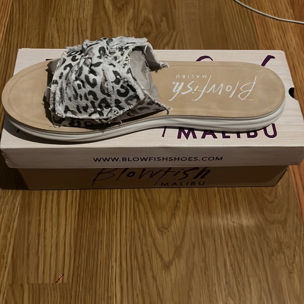 Brand: Blowfish… white print cheetah sandals size 10 in women. Never been used